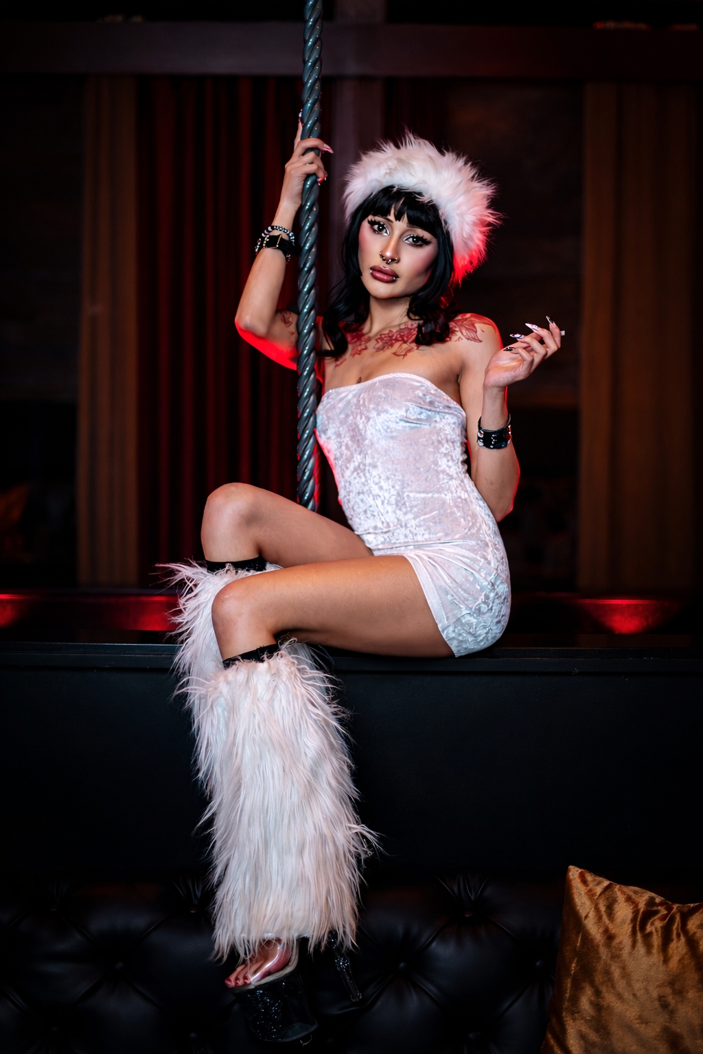 Sexy dancer in white furry outfit